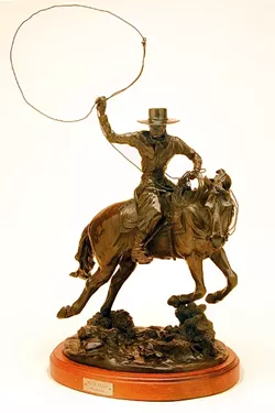 LASSO ’EM UP: In the bronze piece Buckaroo, Pat Roberts captures the movement of a cowboy riding his horse and trying to lasso up a cow. - PHOTO COURTESY OF PAT ROBERTS