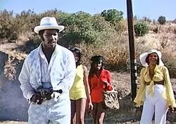 EAT LEAD!: A pimp named Dolemite (stand-up comic Rudy Ray Moore, left) seeks revenge after being framed and sent to prison in this classic 1975 Blaxploitation film. - PHOTO COURTESY OF VINEGAR SYNDROME