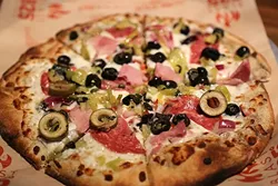 PIZZA, YOUR WAY: At Blast 825 Taproom, you can choose your dough, sauces, toppings, and walk away with a custom personal pizza for less than $10. - PHOTO BY DYLAN HONEA-BAUMANN