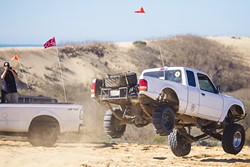 PLAY TIME:  A Ford Ranger completes a small jump off one of the hills at the Oceano Dunes State Vehicular Recreation Area on Jan. 28. - PHOTO BY JAYSON MELLOM
