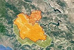 PARCHED FUEL: The last major wildfire to strike Lake Nacimiento was the Weferling Fire in 1960 (outlined in white), which burned 51,451 acres. The Chimney Fire (shown in red) had torched 40,798 acres as of Aug. 24. - SOURCE: CAL FIRE, WILDFIRE TODAY/USFS; MAP COURTESY OF GOOGLE MAPS; GRAPHIC BY ALEX ZUNIGA