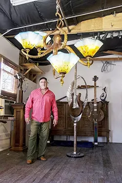 UNDER THE SEA : Dale Evers’ artistic career began with a focus on whales, and sea creatures are still a source of inspiration for him. Evers is pictured here with a recent creation, an octopus lamp. - PHOTO COURTESY OF DALE EVERS STUDIO