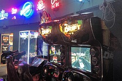EXTRA LIFE:  With old-style arcades going the way of soda fountains, hunting down classic gaming cabinets is part of the fun. - PHOTO BY CHRIS MCGUINNESS