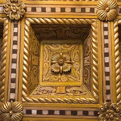 IT’S ALL IN THE DETAILS: Ornate, gilded ceilings like this one adorn many of the rooms at Hearst Castle. - PHOTO BY JAYSON MELLOM