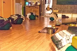 ELEVATE: The Vanaspati Yoga classroom creates a relaxing atmosphere with candles and essential oils while providing complementary vaporizer usage and edibles for its students. - PHOTO COURTESY OF VANASPATI YOGA
