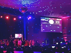 DANCE BREAK: After Dark Bingo players get up out of their chairs and onto the dance floor during an intermission. - PHOTO BY TREVER DIAS