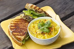 BACK IN BLACK : Although she’s always got different specials on offer, Roxanne’s Cafe chef/owner Roxanne Lapuyade always comes back to her famous (and filling) black bean burger and warming Thai curry soup. - PHOTO BY JAYSON MELLOM
