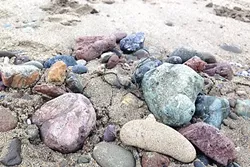 ROCK SPLENDOR: The beaches are chock-full of colorful rocks right now. It’s a blast to admire them—and pick out the good skipping rocks! - PHOTO BY PETER JOHNSON
