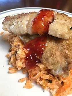 FINE FILLET: Nosh Delights served up a roasted sea snapper with kimchi fried rice and sweet chili sauce at a recent beer pairing event. - PHOTO BY REID CAIN