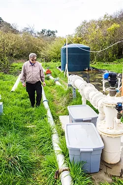 FLOWING: Cambria Community Services District engineer Bob Gresens explains what it takes to purify water enough to supply it as a community resource. - PHOTO BY JAYSON MELLOM