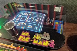 FIST FULL OF QUARTERS: Arcades are few and far between, but if you take the time to look, classic games are right under your nose. - PHOTO BY CHRIS MCGUINNESS