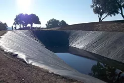 POND PROBLEMS: This 4-acre-foot ag pond serves a vineyard on Willow Creek Road west of Templeton. The permitting process for ag ponds is under fire after a series of controversial ag ponds inflamed tensions in the community over water availability. - PHOTO COURTESY OF THE UPPER SALINAS-LAS TABLAS RESOURCE CONSERVATION DISTRICT