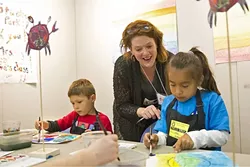 FIELD TRIP: Eve Chatrand works with Leslie Ortiz, right, and Ashton Mayfield, left, from Virginia Peterson Elementary School, during a field trip to Studios on the Park in Paso Robles. - PHOTO BY JAYSON MELLOM