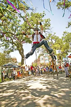 DAY OF WONDER: A stilt walker leaps in the air at the downtown park in Paso Robles as part of Paso ArtsFest last year. - PHOTO COURTESY OF ALLYSON MAGDA