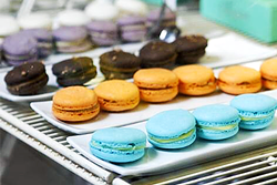 EAT THE RAINBOW:  Macarons of all flavors and colors beckon at Pardon My French Bakery in Grover Beach, formerly Lickity Split Bakery. - PHOTO COURTESY OF PARDON MY FRENCH BAKERY