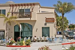 ONE FOR THE LOCALS: Sure, tourists bring in revenue, but locals make the town. Avila Beach’s community of surfers, retirees, and artists now has a new coffee shop to call home. - PHOTO BY HAYLEY THOMAS CAIN