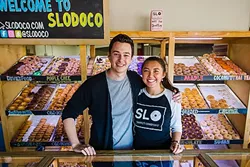 NUTS OF DOUGH : Brandon Miller and Nonny Ross are ready to serve you the best doughnuts in SLO County at SloDoCo. - PHOTO BY JAYSON MELLOM