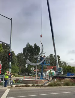 INSTALLATION Sculptor Jeffery Laudenslager's monumental kinetic sculpture Olas Portola is installed in SLO Town on June 9. - PHOTO BY GLEN STARKEY