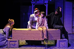 FALLING THROUGH THE CRACKS After growing up in a workhouse, the young orphan Oliver (David Kirkland, center) is sold to the owners of a funeral home Mrs. Sowerberry (Felicia Hall, left of center) and Mr. Sowerberry (Greg DeMartini, right), where he’s forced to sleep in a coffin at night. - PHOTO COURTESY OF DANIELLE DUTRO MCNAMARA PHOTOGRAPHY