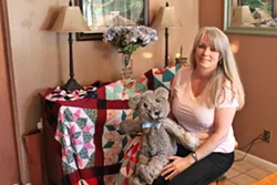 MEMORIES IN THE STITCH Lily Stitches Owner Lisa Adam created a quilt made with patches of her late grandmother’s work and a bear made from a fur coat given to her by her late father. - PHOTO BY CARMEN AGUILA-TORNERO