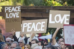 A CALL FOR PEACE SLO County residents packed Mission Plaza to stand in solidarity against hate as part of a "outshine the darkness" rally Aug. 12. - PHOTO BY JAYSON MELLOM