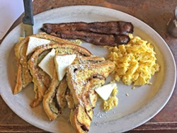 BREAKFAST OF CHAMPS French toast, bacon, and eggs will run you $10 at Charlie's Place. You can add bottomless mimosas to your Sunday brunch for $14. - PHOTO BY PETER JOHNSON