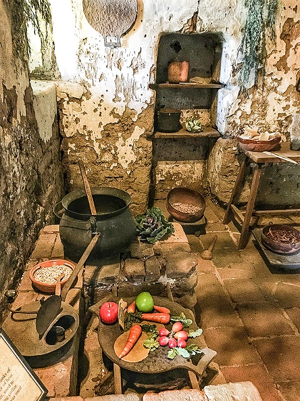 COCINA This kitchen, staged by mission staff members as part of a self-guided tour, no doubt looks as it did in 1848, when the 10 souls were snuffed out on a cold December night. - PHOTO BY GLEN STARKEY