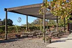 COME HANG Lone Madrone's seating area is where Sunday burger nights unfold each spring and summer. - PHOTO BY HAYLEY THOMAS CAIN