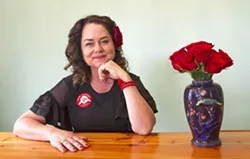 FLOWER POWER Since her mayoral campaign in 2016, SLO Mayor Heidi Harmon has been associated with a red rose that she wears every day, but the trend actually started 20 years ago. - PHOTO BY JAYSON MELLOM