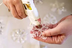 JUST GLUE IT Turns out it's easy to fail at Pinterest, but sometimes you can win, too. Or you can do both by crafting snowflakes out of hot glue, Modge Podge, and glitter. - PHOTO BY JAYSON MELLOM