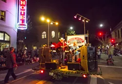 COWBOY UP! Local country music hero Monte Mills pumps up the crowd during the 42nd annual Holiday Parade. The theme this year was Holiday Hoedown. - PHOTO BY JAYSON MELLOM