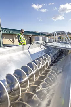 GRAPE MACHINE Technology is becoming part of the harvesting process at wineries in SLO County. - PHOTO BY JAYSON MELLOM