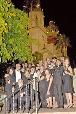 CHEERS Archie McLaren (center) poses with a group of sommeliers in 2006 at the Central Coast Wine Classic's dinner at Hearst Castle. - PHOTO COURTESY OF HISTORY CENTER OF SLO COUNTY