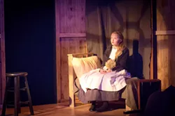 DOWN, BUT NOT OUT Alone in her room, Sara Crewe (Sienna Ritter) dreams of better days after her father's untimely death leaves her orphaned and penniless in A Little Princess. - PHOTO COURTESY OF RYLO MEDIA DESIGN