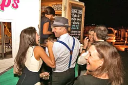 FRESH FROM THE OVEN Sugar Lips Mini Donuts parks its trailer at wedding venues throughout the county to serve up freshly made doughnuts with a variety of toppings. - PHOTO COURTESY OF JESSICA BROWN