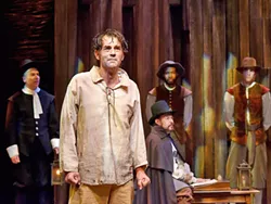 HE SAID, SHE SAID, THEY SAID Andrew Philpot (pictured foreground) delivers a dynamic and complex performance as John Proctor in Pacific Conservatory Theater (PCPA)'s new production of The Crucible. - PHOTO COURTESY OF LUIS ESCOBAR REFLECTIONS PHOTOGRAPHY STUDIO