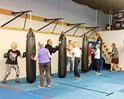 REGAINING STRENGTH Members of Rock Steady Boxing Central Coast are tackling their Parkinson’s symptoms with boxing training. - PHOTO BY KAREN GARCIA