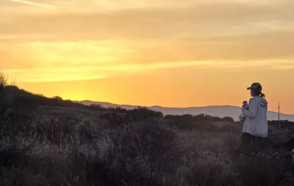 DUSKY SHADOWS Shades of orange color the sky above Carrizo Plain National Monument after the sun sets over the Caliente Range. - PHOTO BY CAMILLIA LANHAM