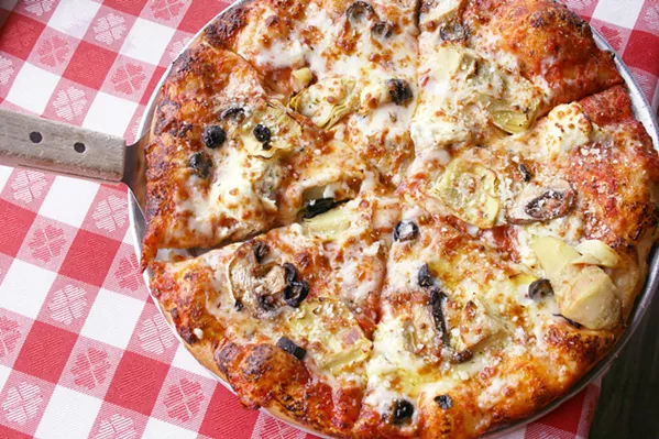 PIZZA LOVES COMPANY Del's classic, comforting pizza topped with mounds of mozzarella is best when shared (although we get it if you prefer your own personal-sized pie). - PHOTO BY HAYLEY THOMAS CAIN