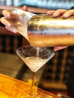 POUR IT Prepping the glass with ice and soda water followed with a rinse of vermouth is the secret to a great martini. - PHOTO BY GLEN STARKEY