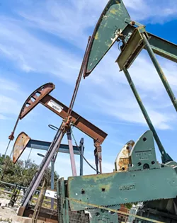 HYDROCARBON LIFELINE Pump-jacks pull oil and water out of the Arroyo Grande oil field in Price Canyon. Sentinel Peak Resources, the field's operator, says an initiative on the November ballot threatens its future there. - PHOTO BY JAYSON MELLOM