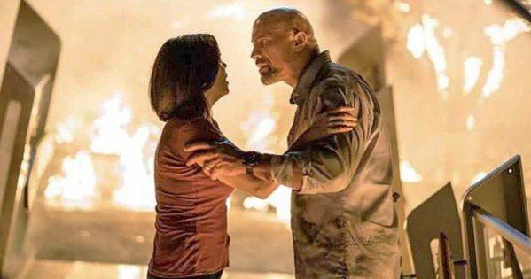ON FIRE In Skyscraper, Will Ford (Dwayne Johnson) is framed for arson and must clear his name and rescue his family. - PHOTO COURTESY OF UNIVERSAL PICTURES