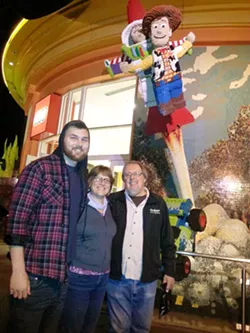 IN RECOVERY Kim Lacey (center) with her son Ty (left) and her husband, Dan Grahm, at Downtown Disney months before Ty died from a heroin overdose in 2016. - PHOTO COURTESY OF KIM LACEY