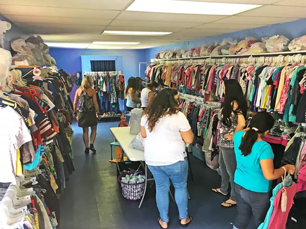 SUPPLIES FOR ALL To make the Children's Resource Network's donation center more fun and welcoming, Program Director Lori Klemowicz said they arranged it to look more like a store. - PHOTO BY KAREN GARCIA