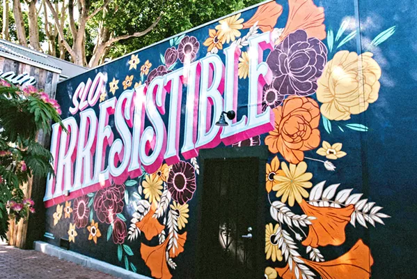 SLOCAL Much of sign painters Buddy Norton and Shelby Lowe's work can be seen around downtown SLO, including this mural in the Creamery. - PHOTOS COURTESY OF CANNED PINEAPPLE CO.