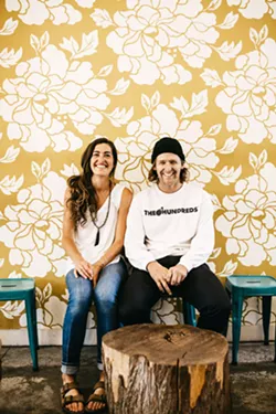 SIGNED Canned Pineapple Co. duo Shelby Lowe and Buddy Norton are based in SLO but are on the road about seven months of the year, painting signs for mom-and-pop shops and corporate businesses alike. - PHOTOS COURTESY OF CANNED PINEAPPLE CO.