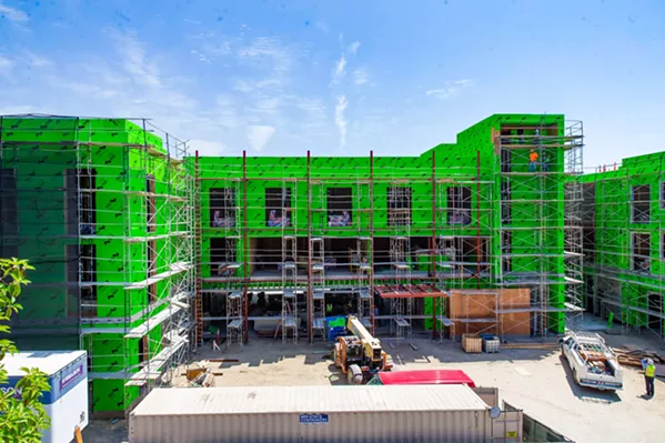 BUILT ENVIRONMENT The Chinatown development project between Palm and Monterey streets in downtown San Luis Obispo has been in the works since 2007, was approved in 2009, and has been under construction since 2015. The development will include 16 condos, a 78-room hotel, and restaurant and retail space. - PHOTO BY JAYSON MELLOM