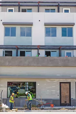 NEW DEAL For many residents, this mixe-use development on Chorro Street represents exactly the direction they don't want San Luis Obispo to go—buildings that are too tall, too wide, and out of place and units that are too expensive built specifically for students. The developer of the mixed-use project, Loren Riehl, has a similar proposal in the works for a property across the street on Foothill Boulevard. - PHOTO BY JAYSON MELLOM