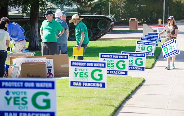 WATER ADVOCATES Supporters of Measure G, the ballot initiative to ban new oil and gas drilling in SLO County, held a rally before an EPA town hall meeting in the SLO Vets’ Hall on Aug. 23. - PHOTO BY JAYSON MELLOM