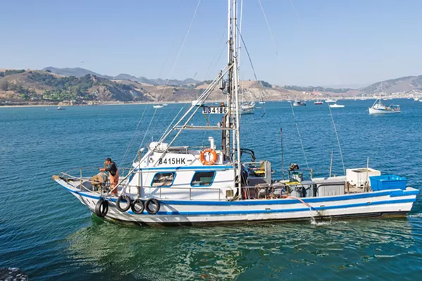 CATCH OF THE DAY Crab and salmon boat Eagle arrives in Port San Luis with a load of rock crab and conch. - PHOTO BY JAYSON MELLOM